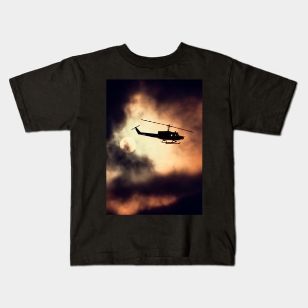 Bell UH-1 Huey in flight Kids T-Shirt by Pitmatic